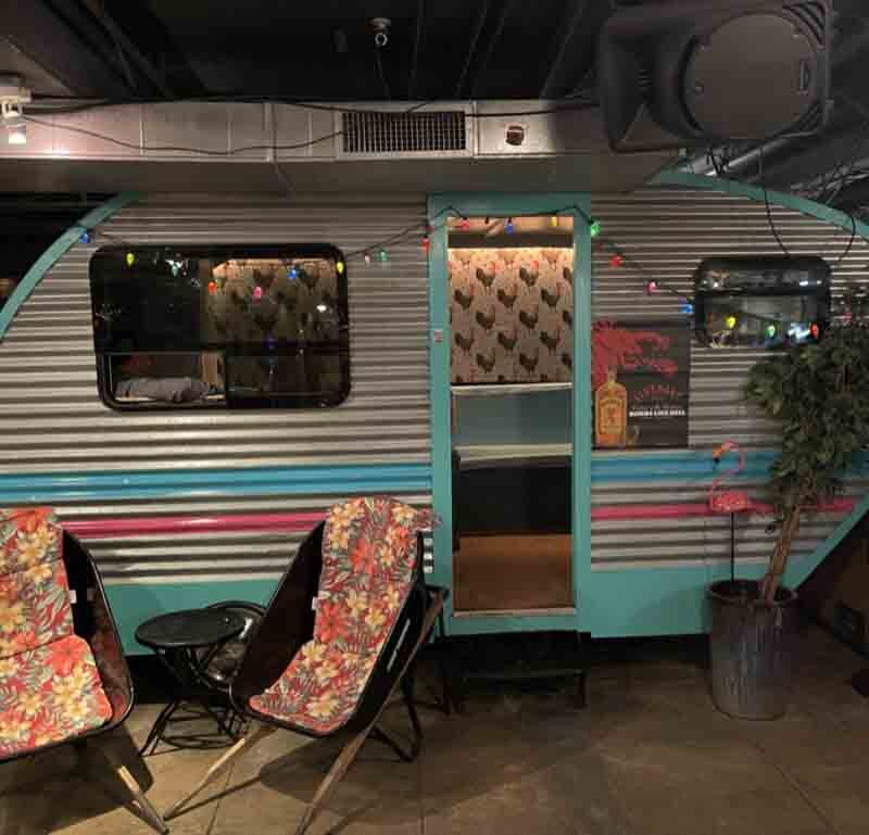 Trailer Park After Dark trailer and chairs